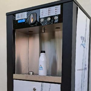 Modern water dispenser, white bottle centered, clean and refreshing atmosphere.
